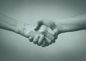 black and white handshake with overlay